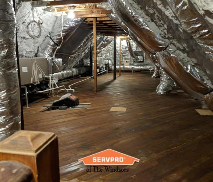 Attic-wood floors, ducting, mechanicals, insulation, SERVPRO logo