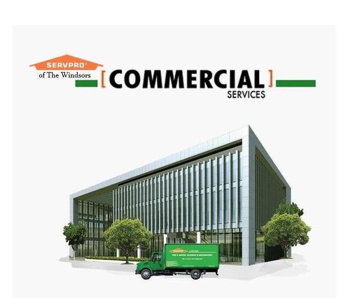 servpro van in front of large metal commercial building, trees, servpro logo, script commercial services