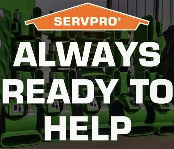 servpro logo and script -always ready to help against a back drop of green air movers