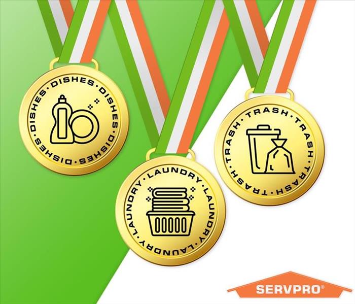 green and white background, three gold medals with orange and green lanyards, SERVPRO logo