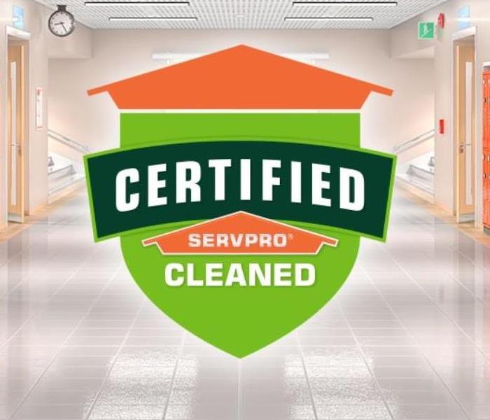 Hallway, green and orange, script: Certified: SERVPRO Cleaned logo